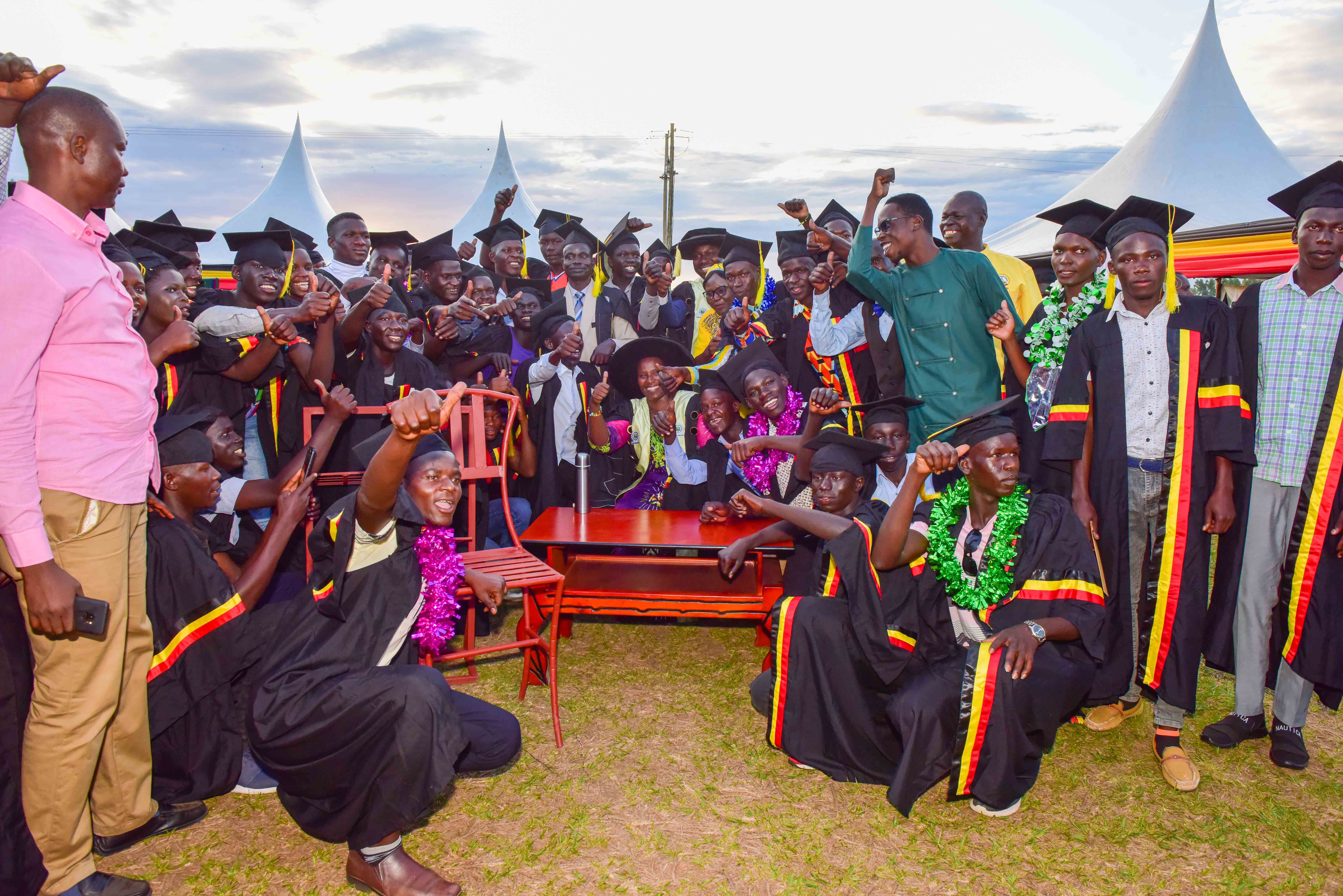 The State House Comptroller Jane Barekye (center) pose for a photo with some of the graduates with some of the works they did at the 1st graduation of the Presidential Initiative for Zonal Industrial Parks for Skills Development, Value Addition and Wealth creation at the Lango Zonal Industrial Hub in Lira district on 3rd January 2023. Photo by PPU / Tony Rujuta.